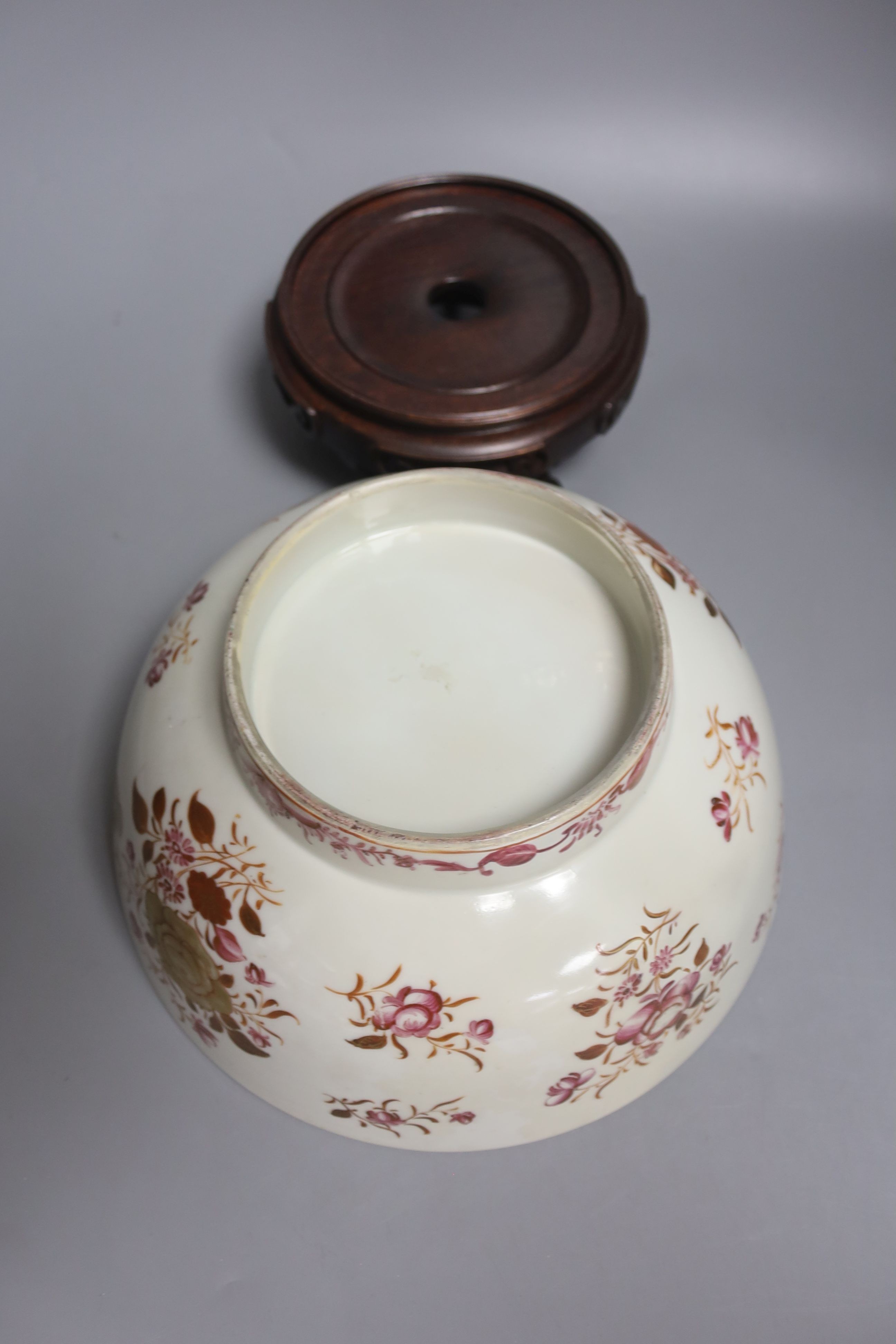 A Chinese export armorial soup plate, a large 18th century Chinese export porcelain footed punch bowl on stand, A Chinese blue and white plates and a pearlware plate